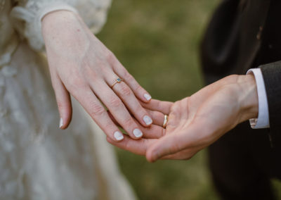 bride and groom hands touching