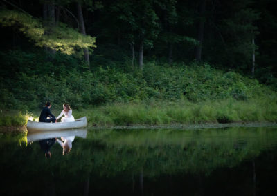 bride and groom on canoe