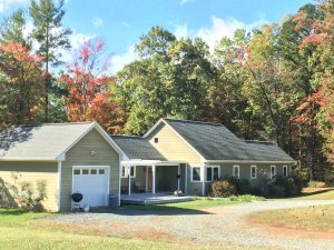 Mountain cabin with green siding
